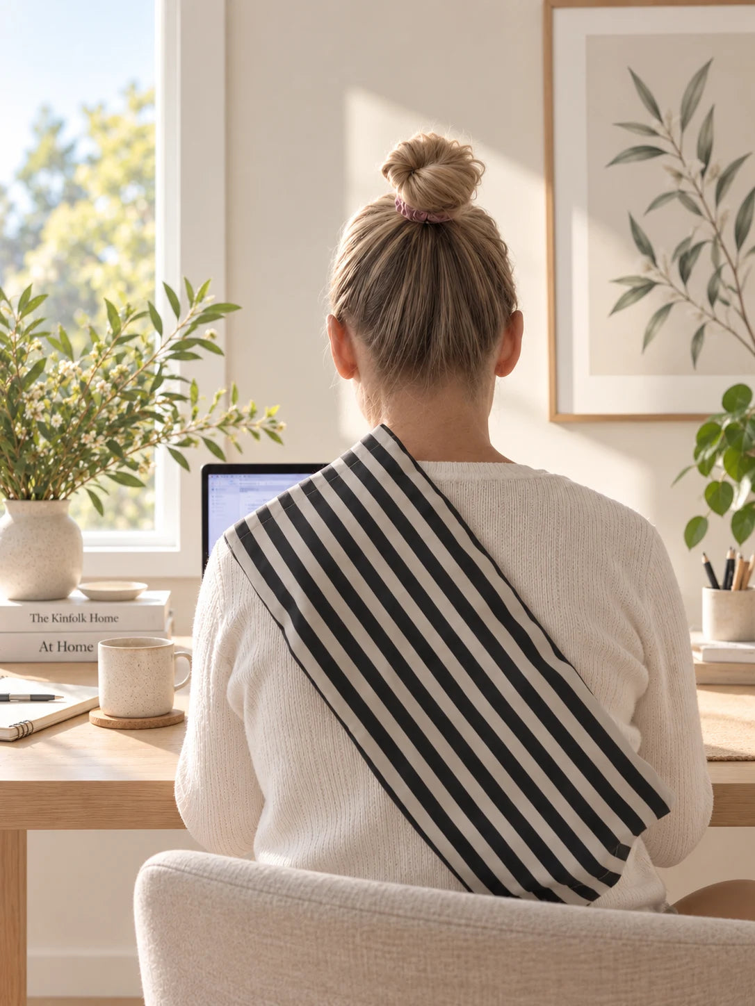The Hug Pine/Natural Stripe cover worn over the shoulder